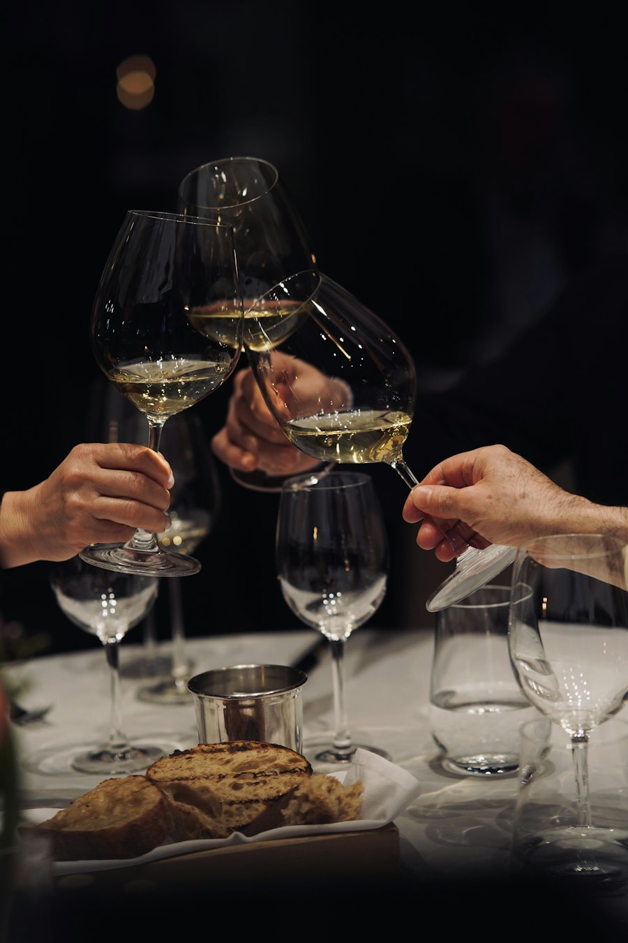 Glasses meeting over a restaurant table